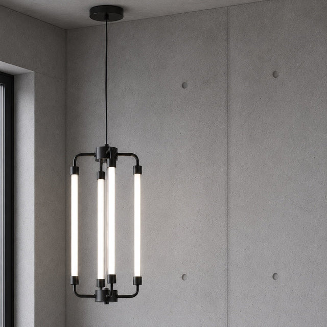 A modern industrial-style pendant light with four vertical white cylindrical tubes mounted on a black metal frame, hanging against a textured gray concrete wall.