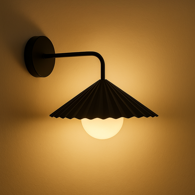Black wall-mounted lamp with a scalloped shade on a warm beige background