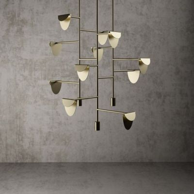 Modern chandelier with multiple light fixtures on a gray background