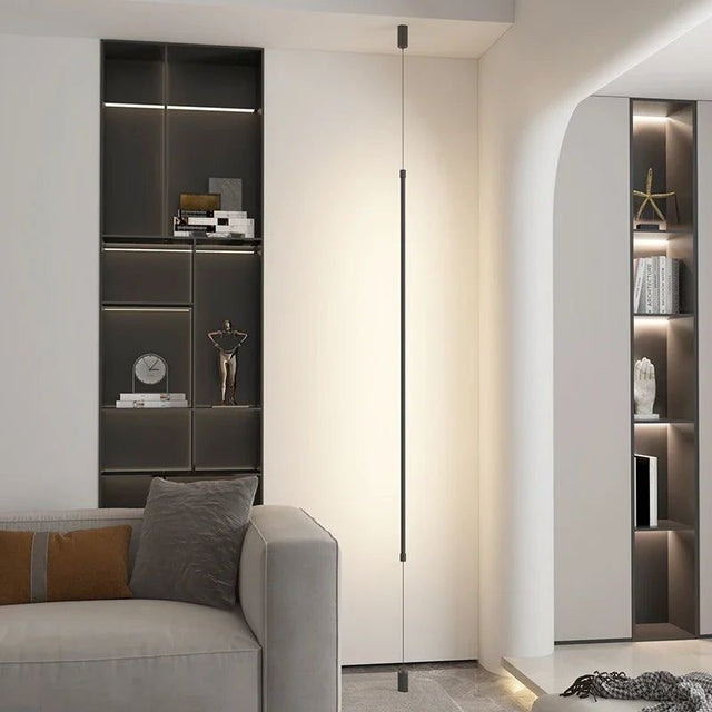 Modern interior with a gray sofa and wall-mounted shelves.