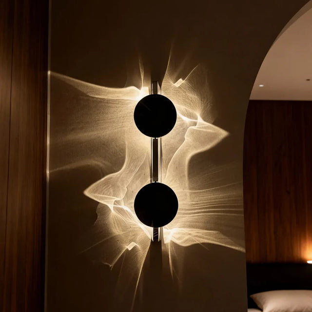 Modern wall lamp with abstract design in a bedroom setting