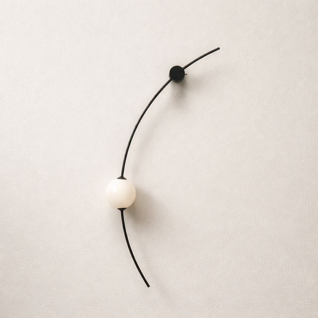 Minimalist necklace with a white pendant and black cord on a beige background