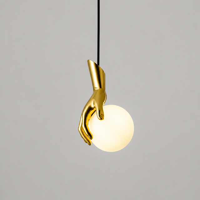 Gold hand-shaped pendant light on a gray background