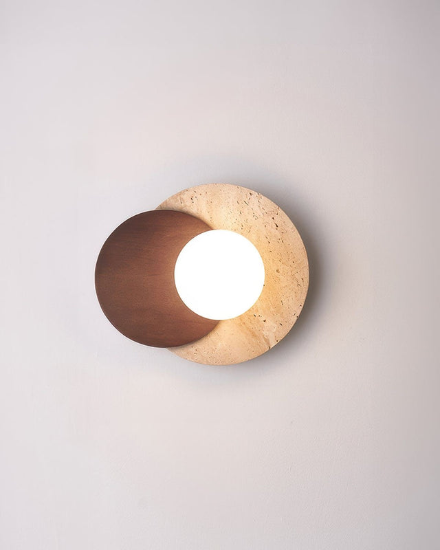 Modern wall light fixture with a wooden and stone design on a neutral background