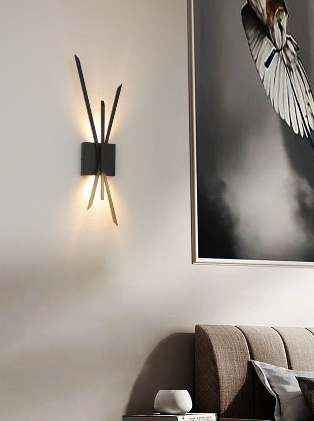 Modern wall sconce with a framed artwork on a wall in a room.