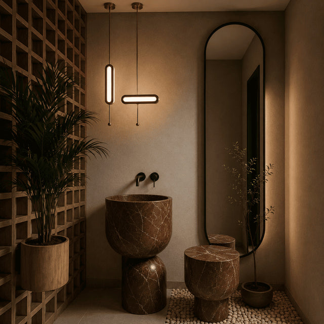 Modern bathroom with marble sink and stool, pendant lights, and a large mirror.