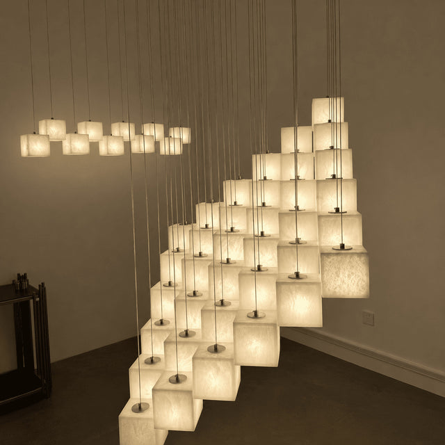 Modern chandelier with square lampshades in a room setting