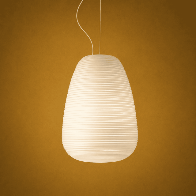 White pendant lamp against a warm brown background