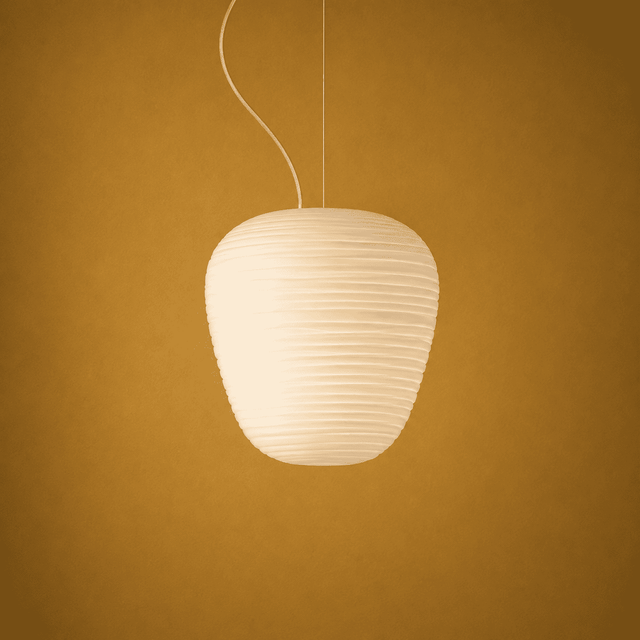 White pendant lamp against a yellow-brown background