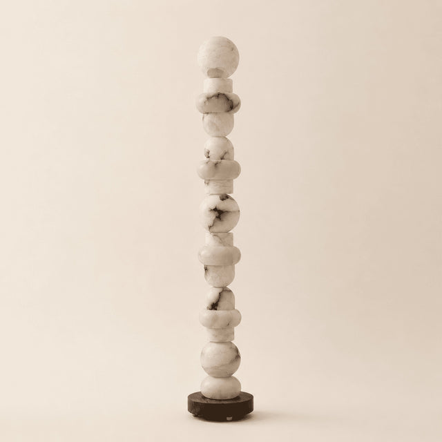 Stack of marble stones on a beige background