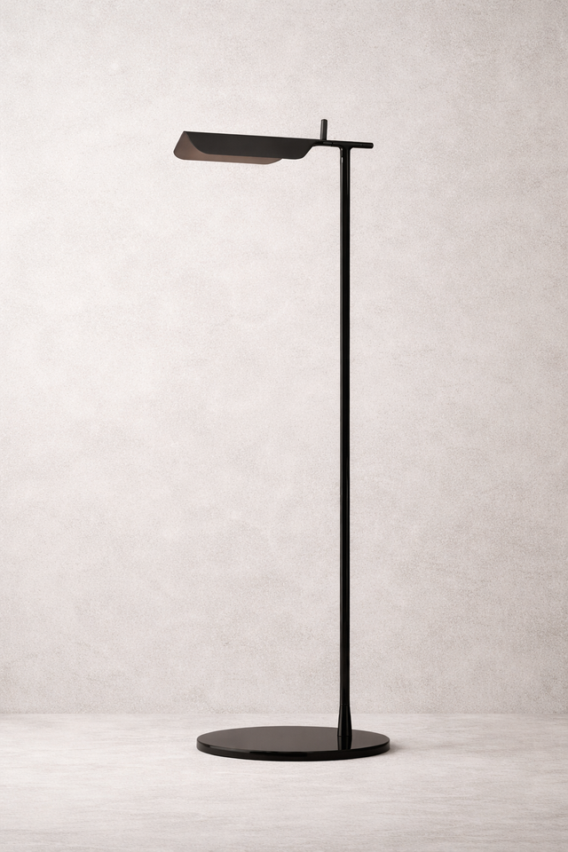 Modern black floor lamp on a light gray background