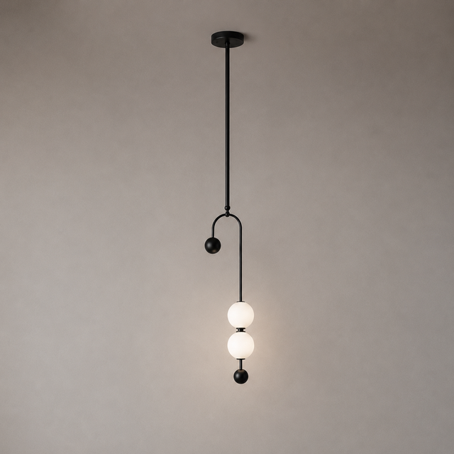 Modern pendant light with two glass bulbs on a neutral background