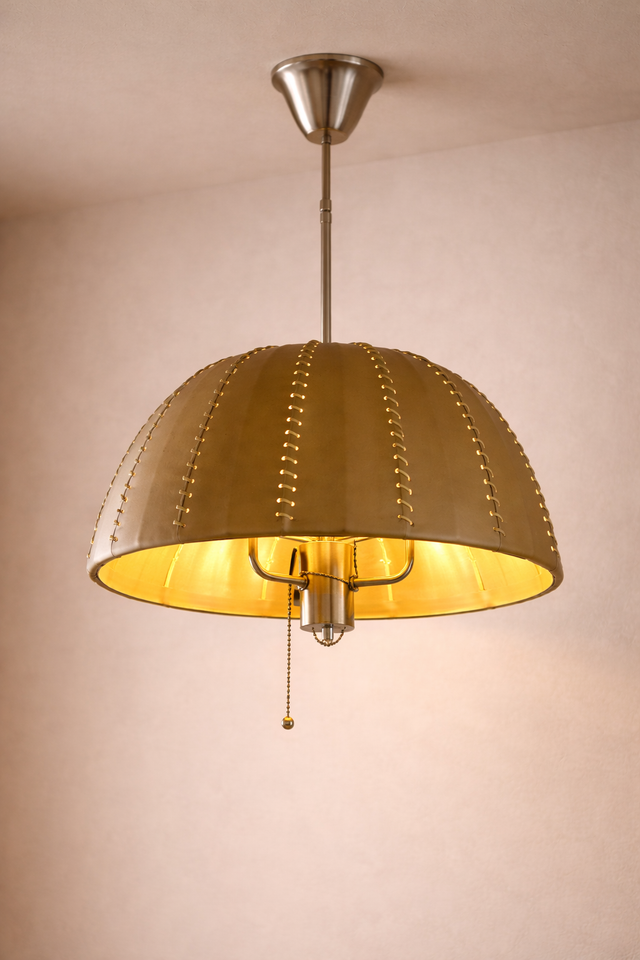 Gold pendant light fixture on a beige background