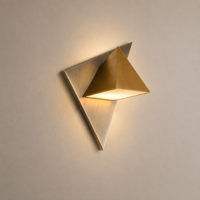 Modern wall sconce with geometric design on a neutral background