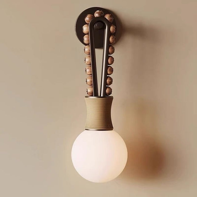 Decorative wall light fixture with a bulb on a beige background