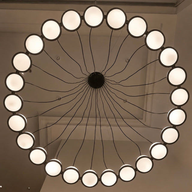 Modern chandelier with multiple light bulbs on a ceiling